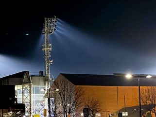 outside of Selhurst Park stadium at night with floodlights on